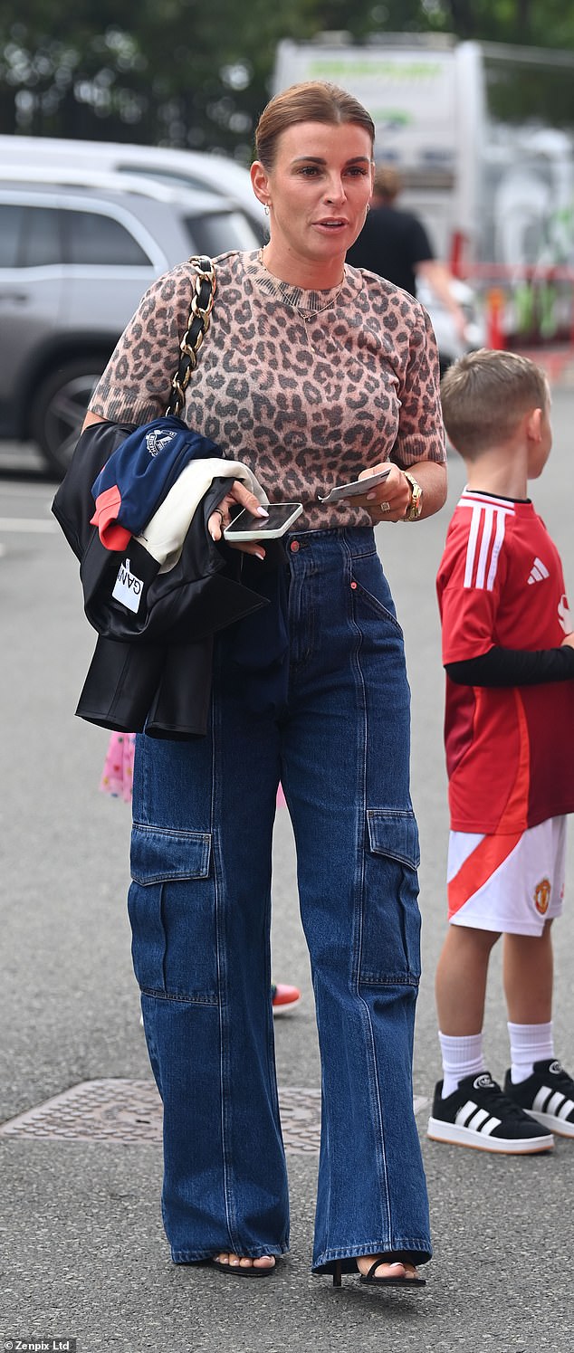 The glamorous mother of four looked stylish in a leopard print top and navy jeans