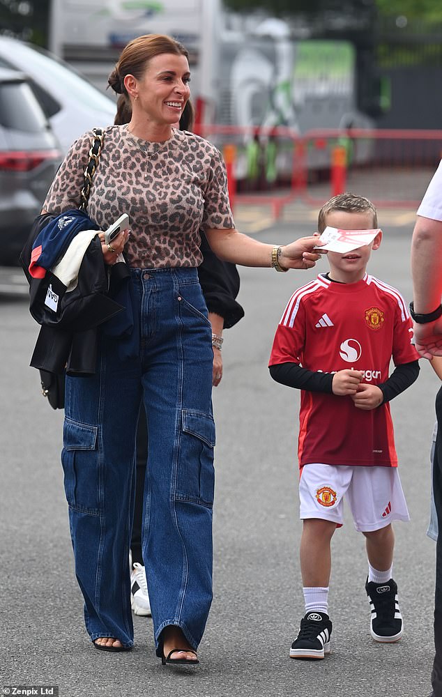 Earlier in the day, Coleen was spotted making a glamorous entrance into the stadium with her son Cass, five, who looked stunning in his Manchester United football kit