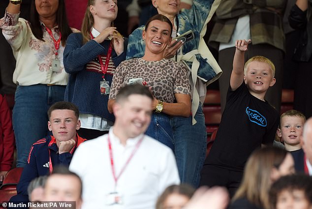 Coleen's son Kai (pictured left) looked on proudly as his father returned to Old Trafford and pulled on the iconic Red Devils 10 shirt for the first time in seven years