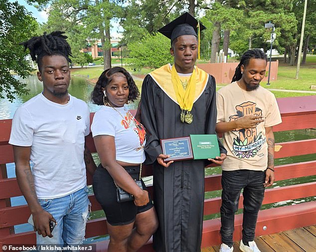 Jezavion (left) at his younger brother Keshoan's high school graduation ceremony, along with his older brother Daveon (right) and mother Lakisha Whitaker