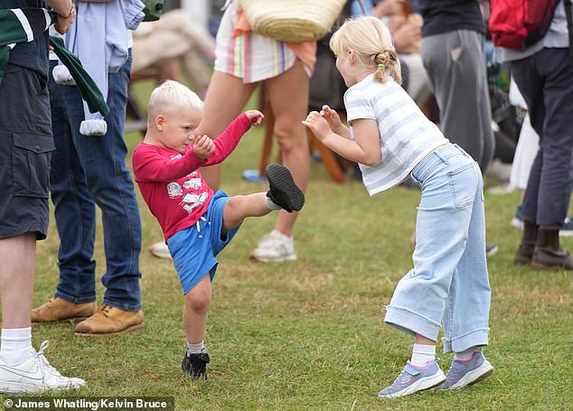 Lucas, three, shows off his karate skills to his six-year-old sister Lena