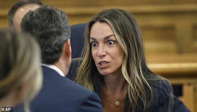 Read speaks with her attorney — and has a bewildered expression on her face — as the jury deliberates in her murder trial in Norfolk Superior Court in Dedham, Massachusetts, in June.