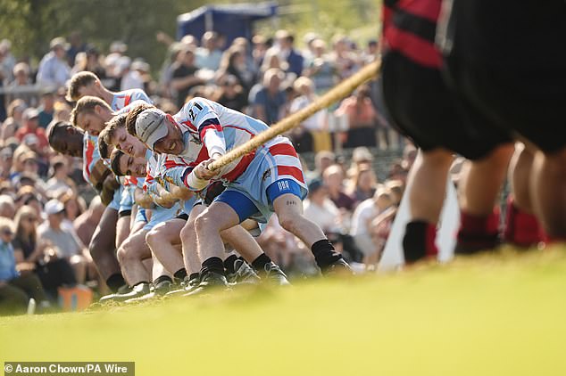 Competitors take part in a tug of war during the Braemar Gathering highland games