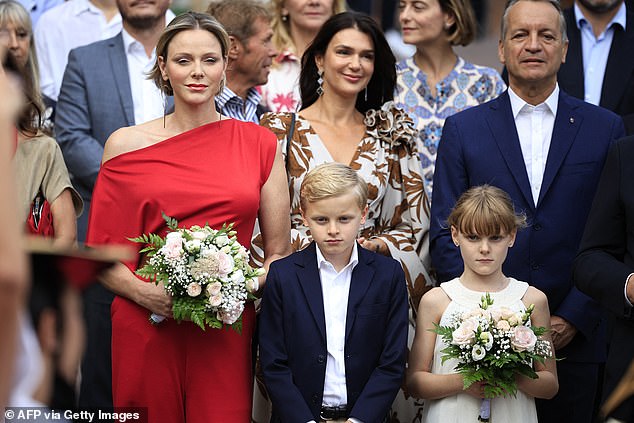 Princess Gabriella held a bouquet of soft pink flowers, just like her mother, as the stylish European family graced the annual picnic in Monaco