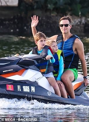 He had one of the boys drive the boy while he calmly held on to the back of the jet ski