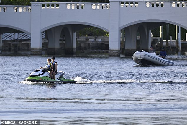 Security was seen keeping a close eye on the family while they were on the jet skis