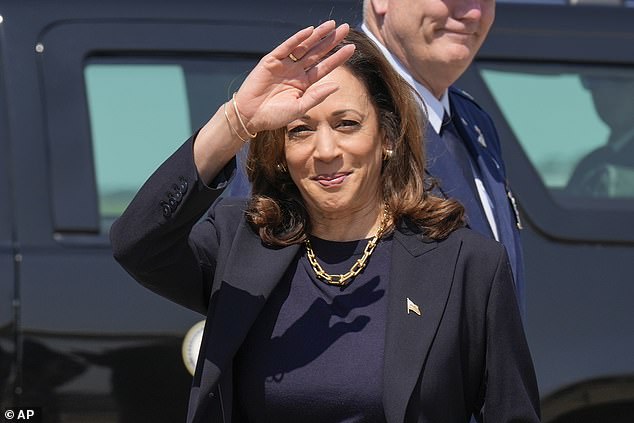 Kamala Harris waves to media as she arrives in Pittsburgh, days before the first presidential debate