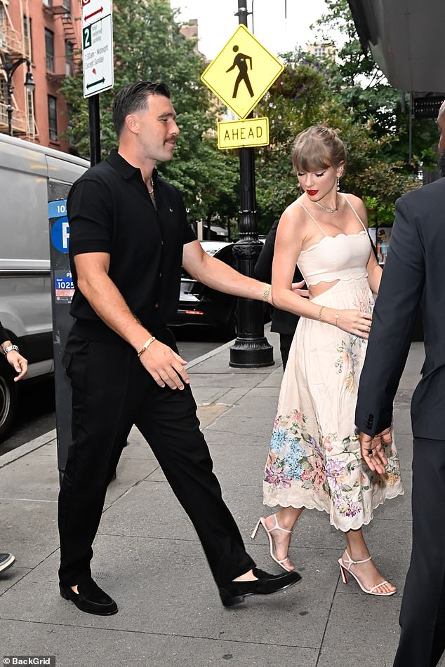 Travis, ever the gentleman, led Taylor into the studio with a hand on her back