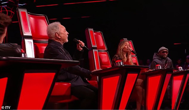 The judges of the ITV talent show were also moved by Will.i.am, 49, (far right) who looked serious as he watched the two musical legends