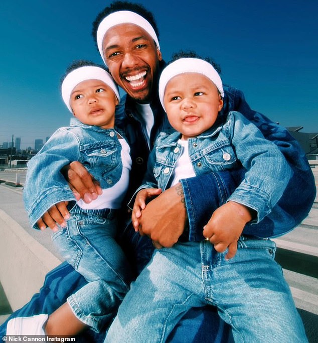 Nick is pictured with his three-year-old twins Zion and Zillion - whom he shares with Abby De La Rosa - in a post celebrating their second birthday