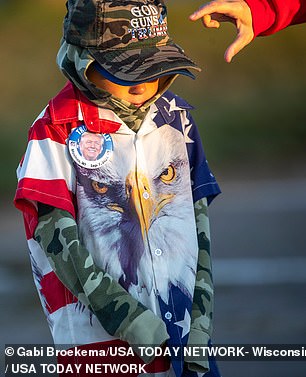 Many were dressed warmly on a cold Wisconsin day, but the sun shone on the airport tarmac as the GOP candidate spoke for more than 90 minutes