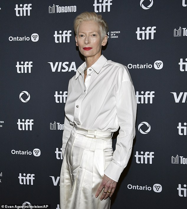 Swinton showed off her unique sense of style in a silky white blouse