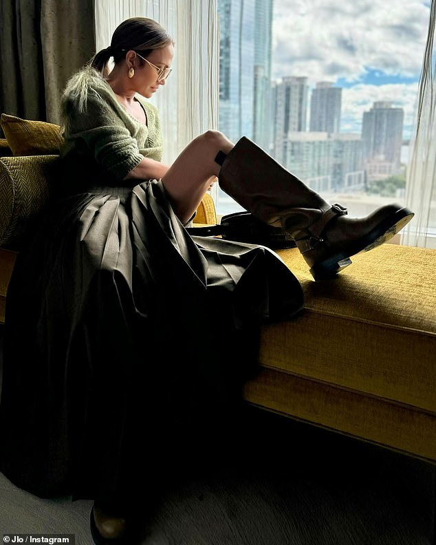 In one photo, Lopez was seen reclining on a chaise lounge in front of a window with the Toronto skyline in the background. The Atlas star said she was 