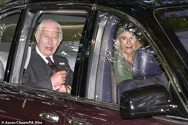 He wore a charcoal grey suit for the occasion, paired with a black and burgundy tie, while Queen Camilla opted for a red and green tartan ensemble, complete with matching hat.