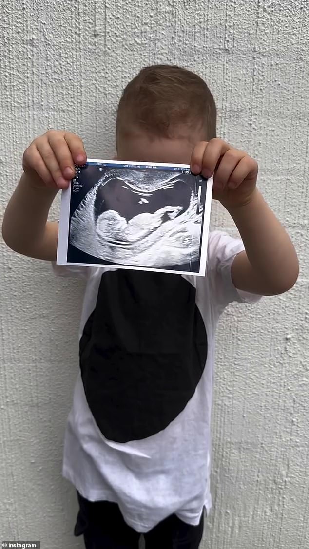 The Collingwood Premier League defender shared the news on Instagram on Sunday, along with footage of his adorable son Zander. In the video, the three-year-old can be seen holding up an ultrasound scan to a whitewashed wall. Pictured