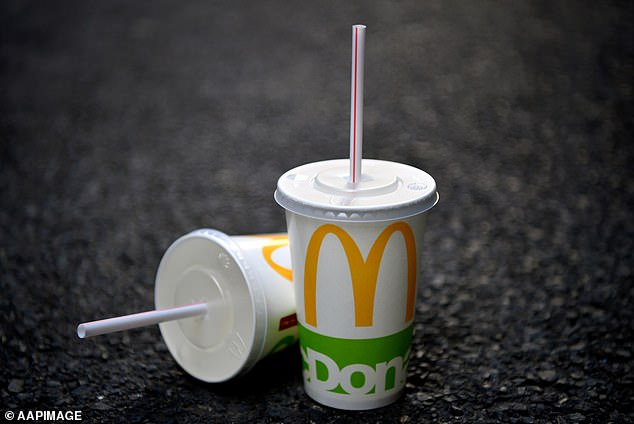 A McDonald's cup and a plastic straw before several major cities and municipalities banned them