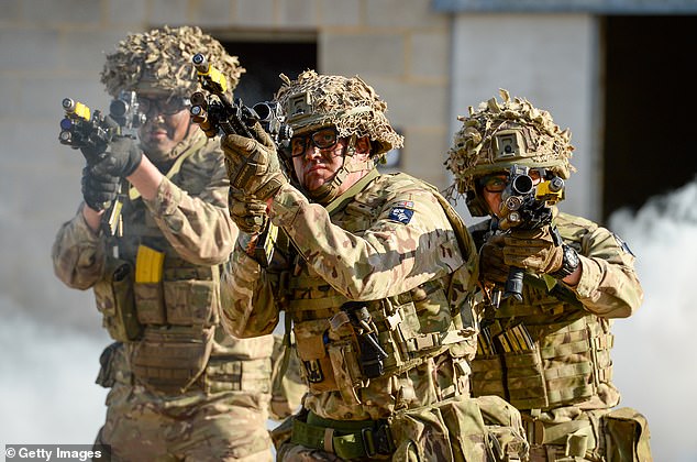 It comes amid a movement to use better technology and AI to prepare for complex future warfare. Pictured: Soldiers in Salisbury demonstrate the EXO Insight goggles, a virtual eye tracking behaviour monitoring system