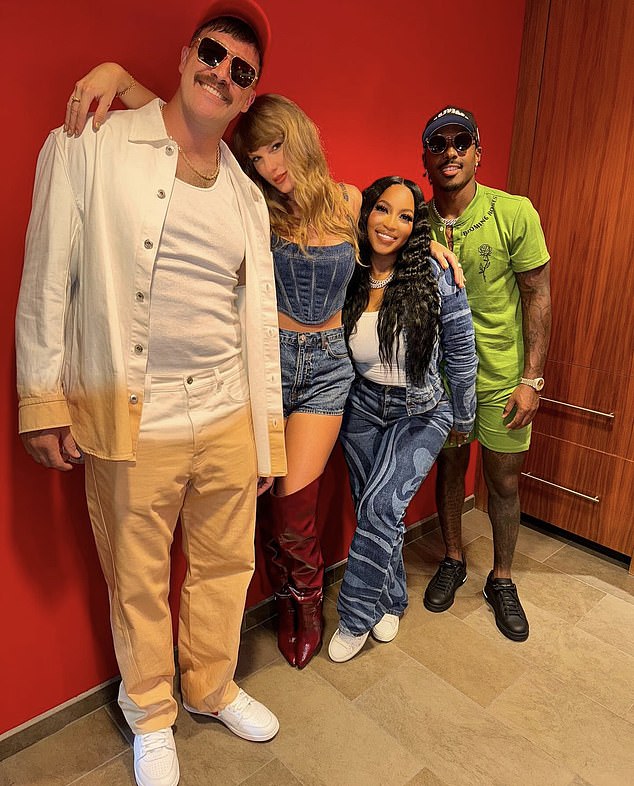 The couple poses with Kelce's teammate Mecole Hardman Jr (right) and his girlfriend Chariah Gordon (second from right) after Thursday's win over Baltimore