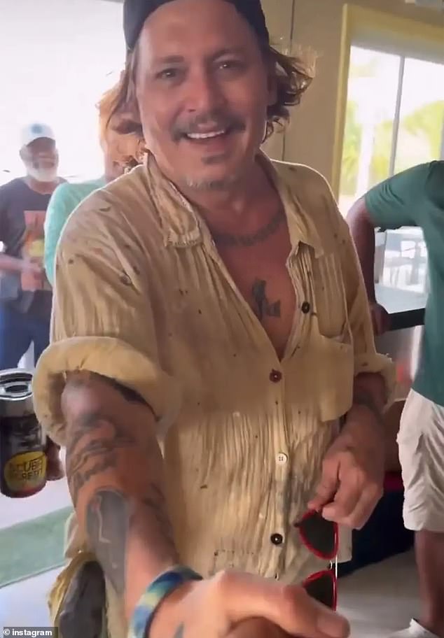 In a clip posted to social media by a bartender in the Bahamas, the actor grins wide and bright, prompting fans to point out his dental transformation