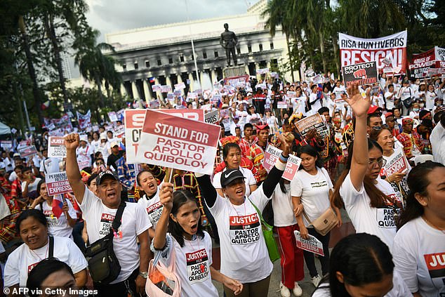 Followers of Apollo Quiboloy hold a prayer meeting in a park in Manila on March 4, 2024