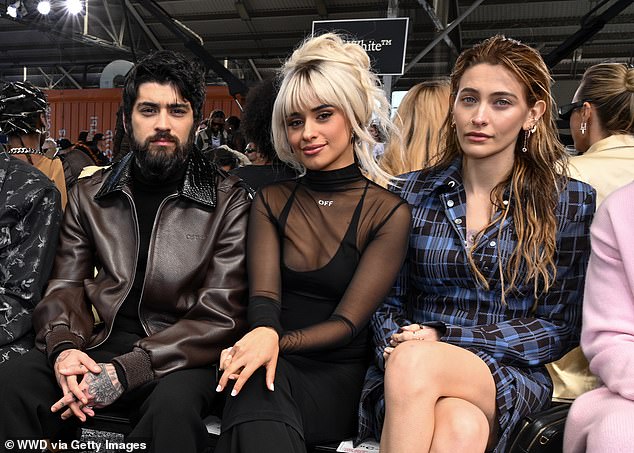 Zayn was in famous company at the Off-White show in New York on Saturday, where he wore a brown leather jacket with a faux crocodile collar