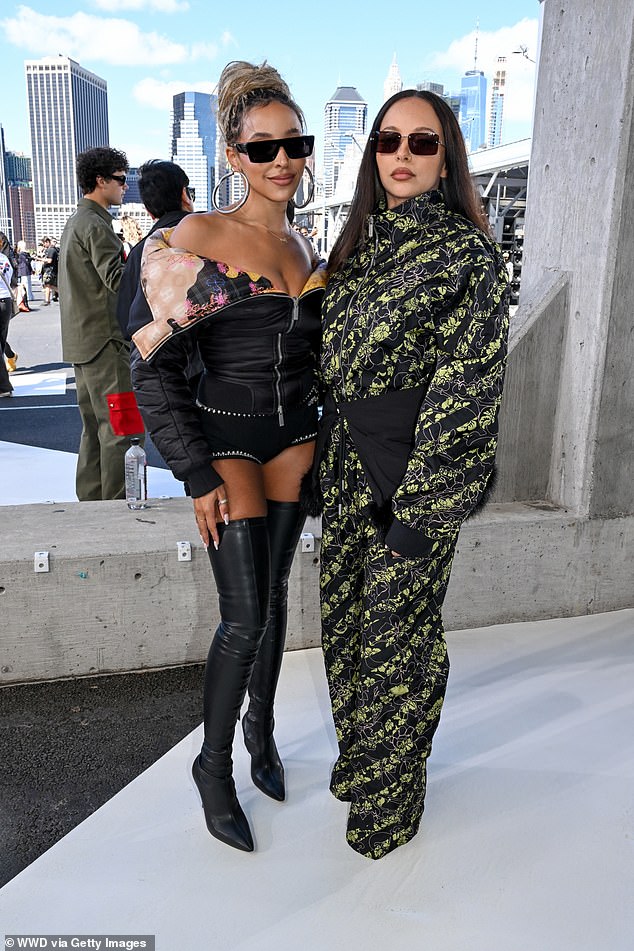 The star was in good company and was spotted posing with fellow singer Tinashe (left), who put on a lengthy show in a pair of micro shorts and thigh-high black leather boots