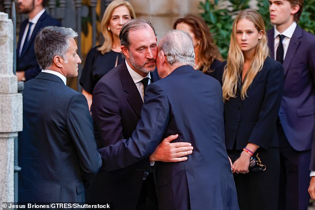 King Juan Carlos I was photographed greeting another mourner at his cousin's funeral