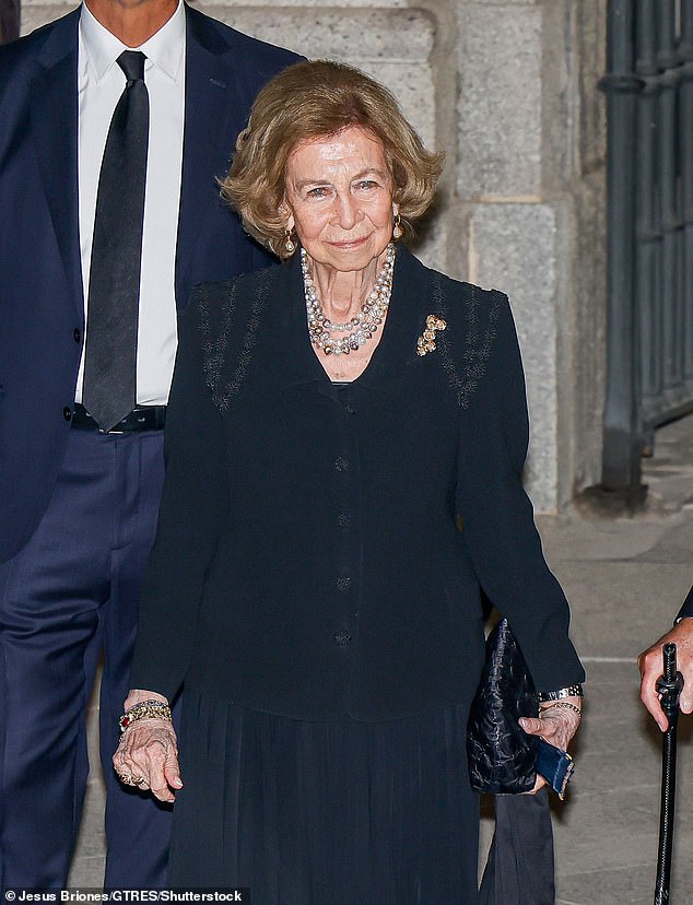 Queen Sofia of Spain accented her black outfit with three strings of pearls and numerous bracelets