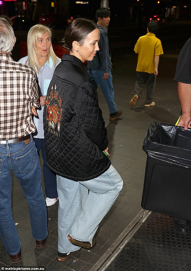 She completed her relaxed look with black sneakers and appeared to be in a great mood as she headed to the venue to see her eldest child perform.