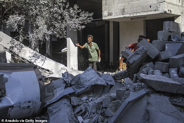 Violence in the West Bank has increased, as has the war in Gaza that began after Hamas attacked Israel on October 7 (Photo: People are seen in the area after the Israeli army attack on the Amr Ibn al-Aas school in Gaza City)