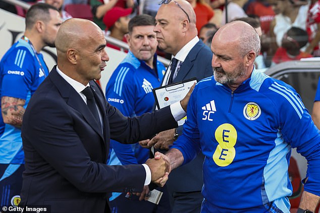 Steve Clarke, right, congratulates Roberto Martinez after a difficult end for the Scots