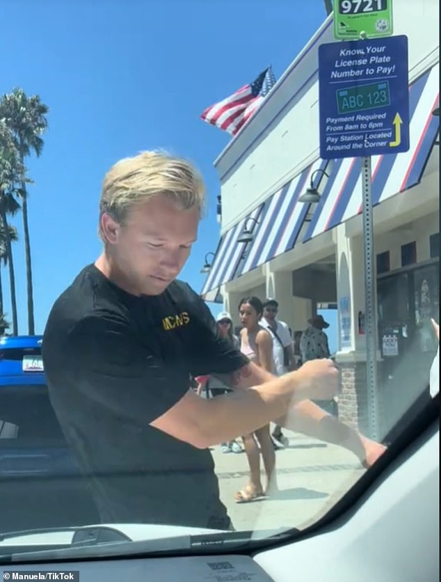 Nigel Ford, pictured, was caught on camera slamming his body into the side of a car after his parking space was taken by another driver