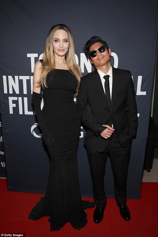 The 49-year-old A-lister and her 20-year-old son Pax posed together as they attended the red carpet premiere of her film Without Blood at the Toronto International Film Festival on Sunday night