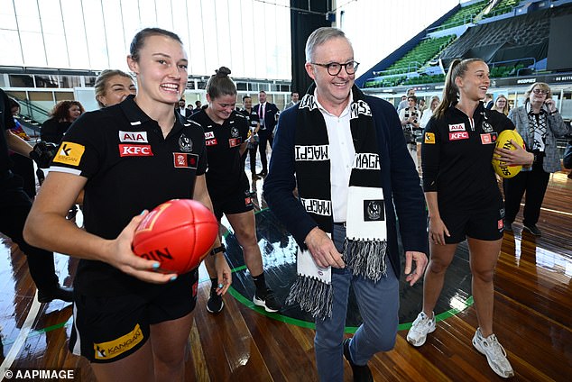 Not a diehard: here's the Prime Minister with his Collingwood scarf last September...