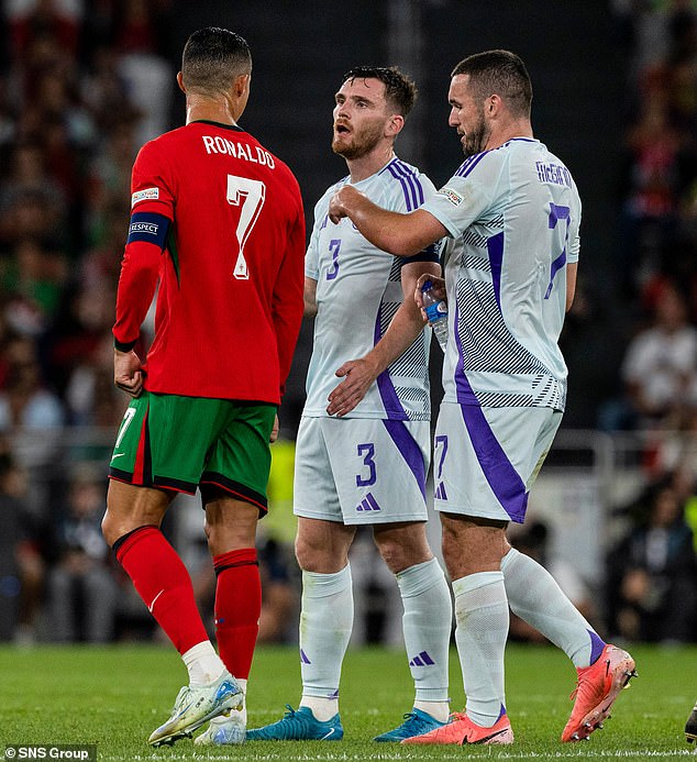 Ronaldo exchanges words with devastated Scotland captain Andy Robertson during the final phase