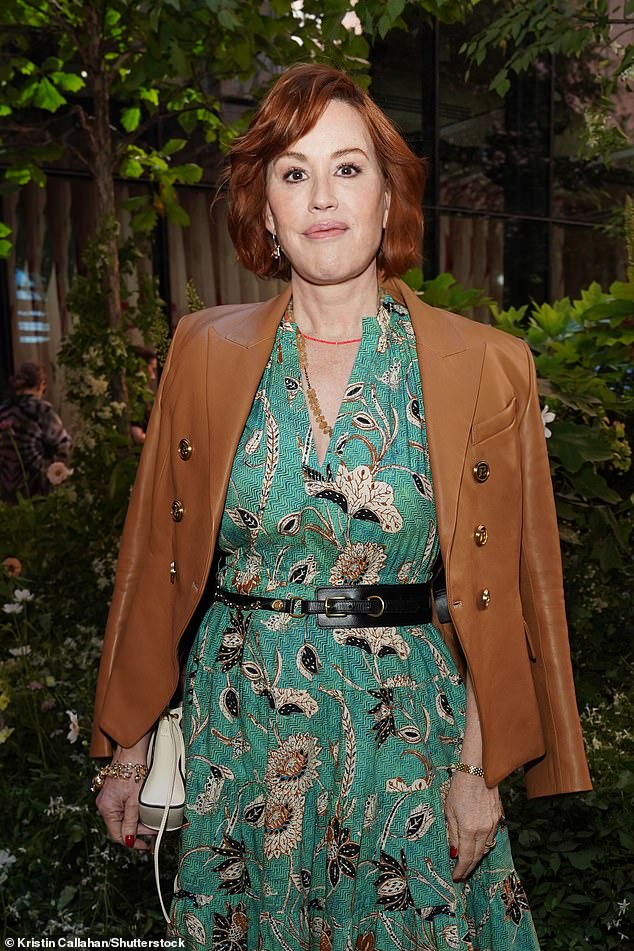 Ringwald was spotted in a gorgeous green floral print dress that reached down to her calf-high mint green boots