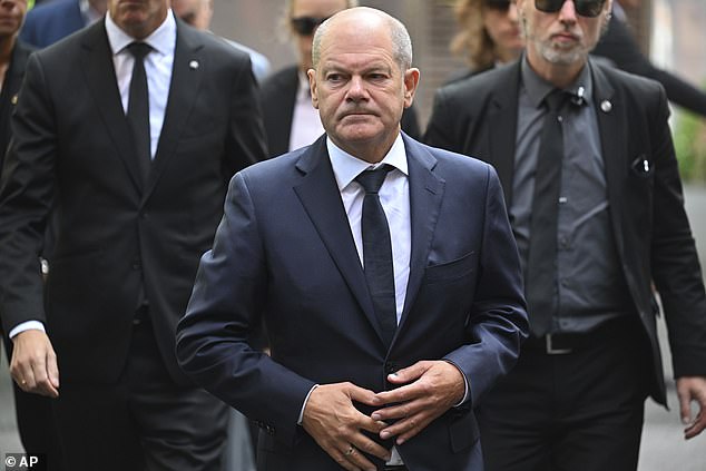 German Chancellor Olaf Scholz visits the scene of the knife attack on August 26