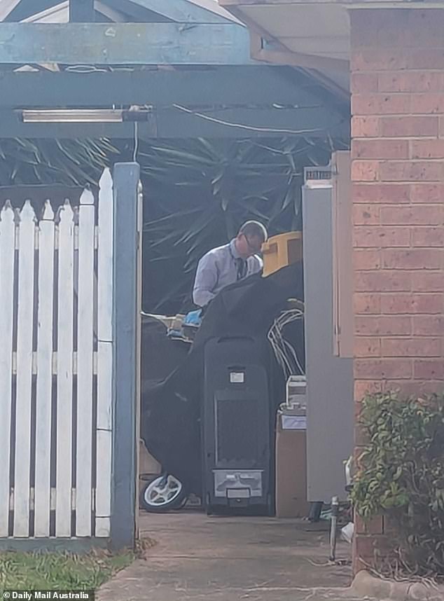 Forensic police were seen combing through rubble outside the home after arriving at the scene alongside fire investigators and Victoria Police's arson squad