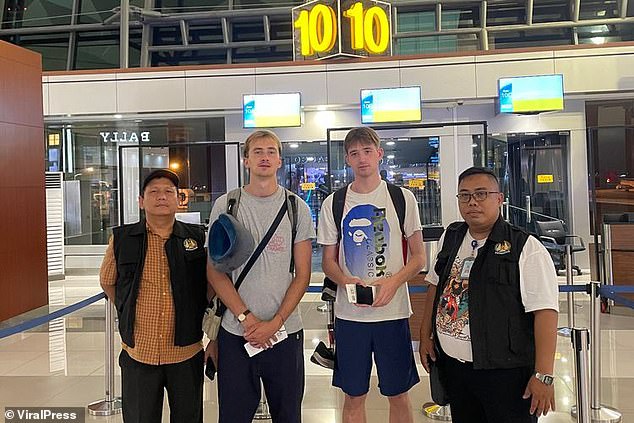 The couple in the photo at the airport in Indonesia when they were deported