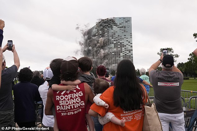 Locals watch the implosion of the Hertz Tower on Saturday, September 7, 2024. The once iconic skyscraper became a symbol of destruction in Lake Charles after it was devastated by back-to-back hurricanes nearly four years ago.