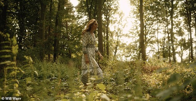 The princess walks through the forest under dappled sunlight during the video released alongside her statement