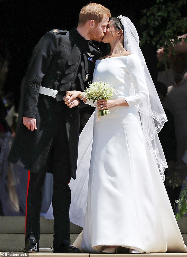 Clare Waight Keller, former creative director at Givenchy, was the designer behind Meghan Markle's wedding dress (pictured: Prince Harry and Meghan Markle at their wedding in Windsor in May 2018)