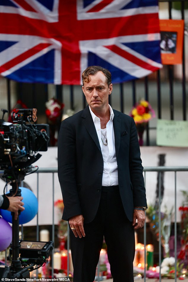 Jude looked handsome in a black suit and an open white shirt as he filmed scenes for his upcoming role in Netflix's Black Rabbit