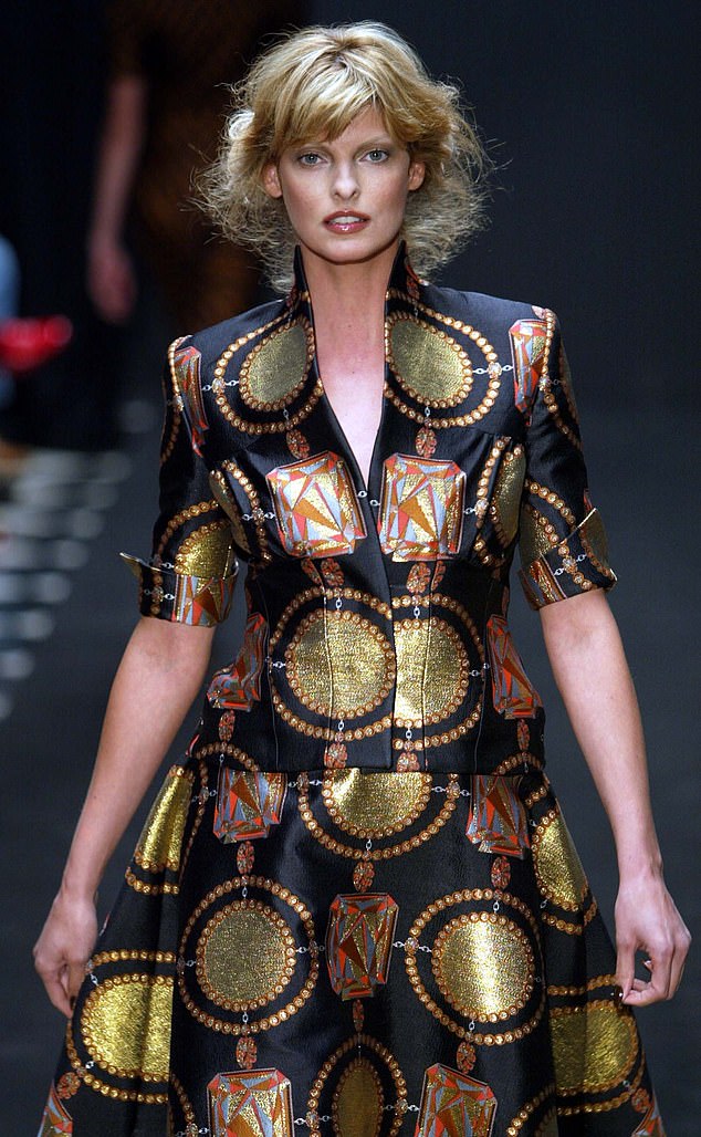 Linda walks for Giles Deacon at London Fashion Week, modeling a blonde look