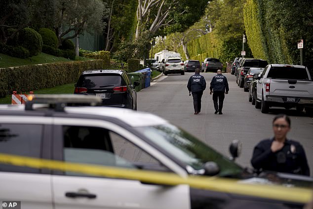 A source confirmed that Diddy - real name Sean Combs - plans to leave LA after the raid (pictured) - and that he is spending most of his time in Miami