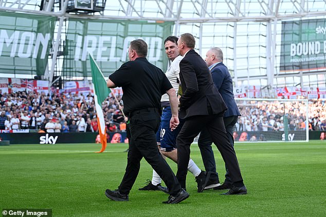 He was later escorted off the pitch by security personnel ahead of kick-off in Dublin on Saturday