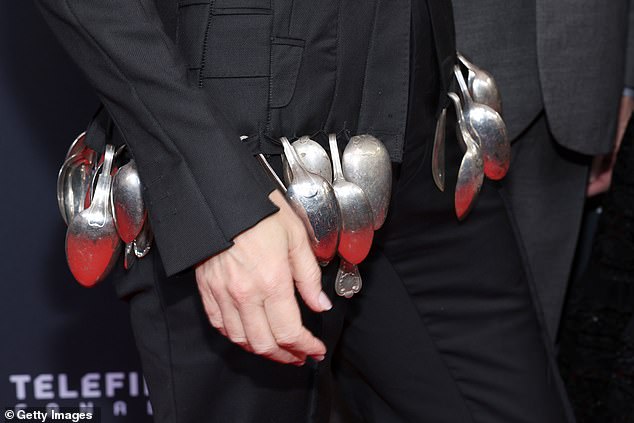 The spoons ran all the way around the bottom of the jacket, forming a sort of bustle-like element across the back, where the spoons lay on top of each other for volume