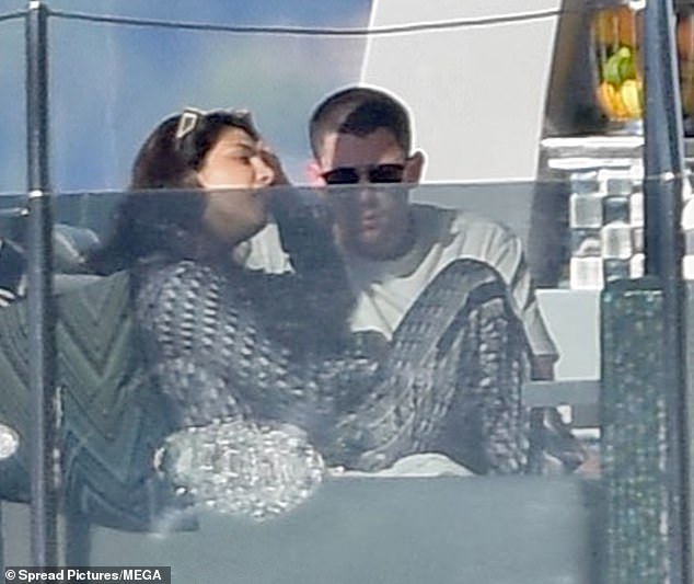 The Love Again actress was spotted sitting on a stand on the yacht and Jonas briefly joined her before going for a swim. His wife, whom he married in 2018, put on a stylish show in a black and white patterned pyjama set