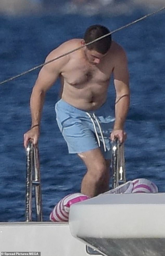 Jonas was spotted getting into the water wearing a pink and white striped swim ring