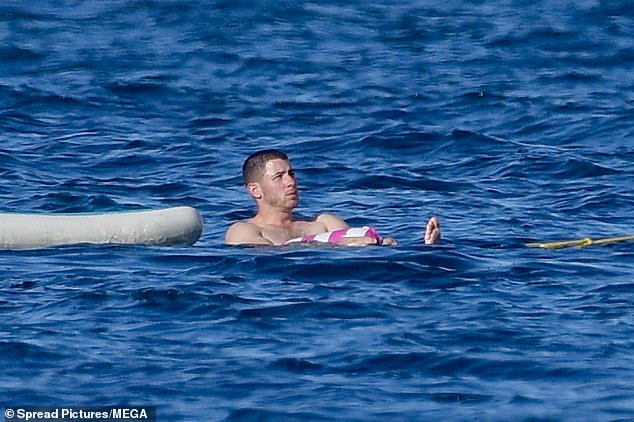 He enjoyed some time alone with the waves lapping around him